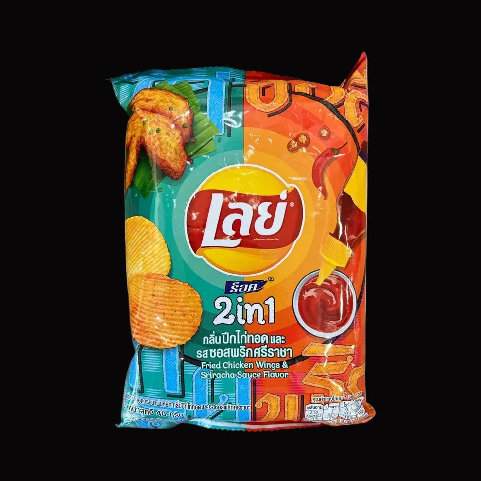 A bag of Lay's 2-in-1 mixed flavor potato chips with Thai text, featuring a colorful design with red, orange, yellow, and blue sections and images of chicken wings and potato chips.