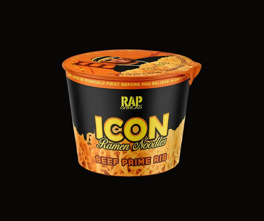 A single cup of RAP Snacks Icon Ramen Noodles Beef Prime Rib on a solid black background. The packaging features a black body with a bright orange lid and bottom graphics, and the brand name 'RAP Snacks' is clearly visible in yellow.