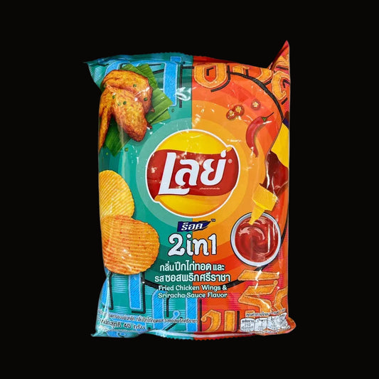 A bag of Lay's 2-in-1 mixed flavor potato chips with Thai text, featuring a colorful design with red, orange, yellow, and blue sections and images of chicken wings and potato chips.